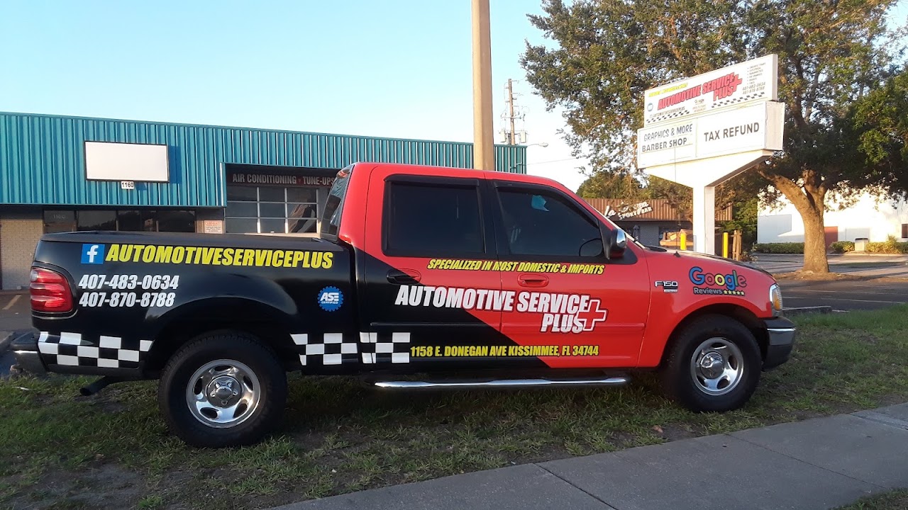 Automotive Service Plus workshop exterior with a professional service truck in the foreground. The modern facility stands under a bright Florida sky, reflecting professional-grade car care standards.